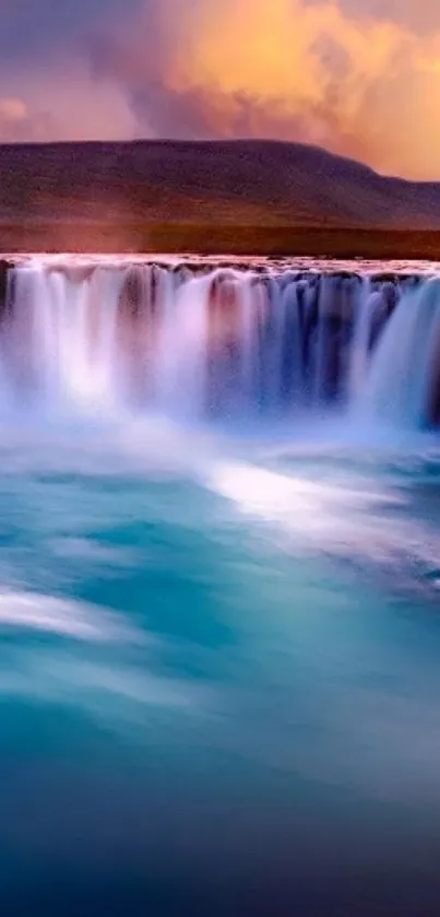 Waterfall with vibrant blue water under a sunset sky.