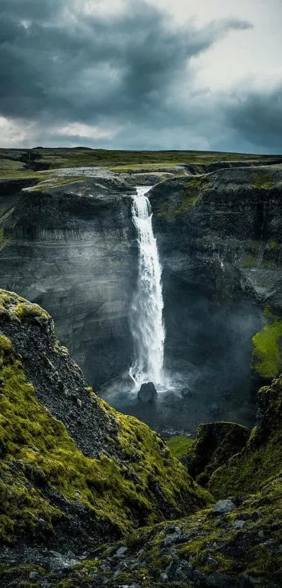 Breathtaking waterfall cascading down cliffs surrounded by lush greenery.