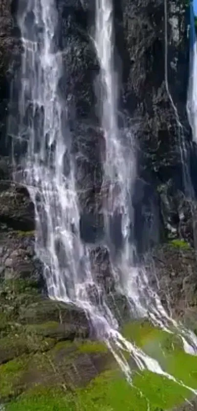 Water cascading down a rugged cliff face.