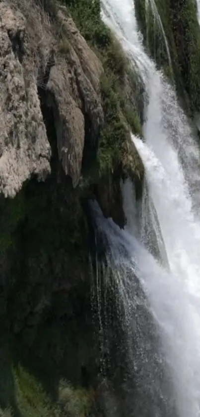 Cascading waterfall over a rugged cliff.