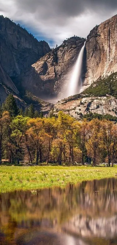 Majestic waterfall surrounded by lush trees and mountains.