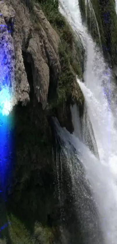 Waterfall with greenery and blue light.