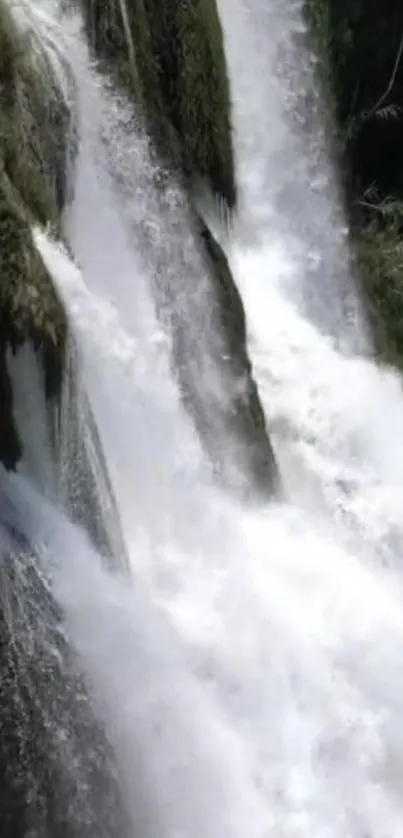 A stunning waterfall cascading down with surrounding greenery.