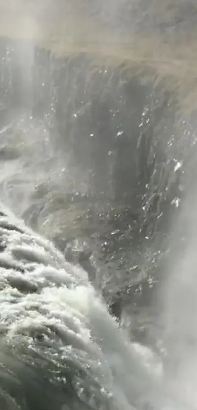 Close-up view of a stunning waterfall with cascading water and mist.