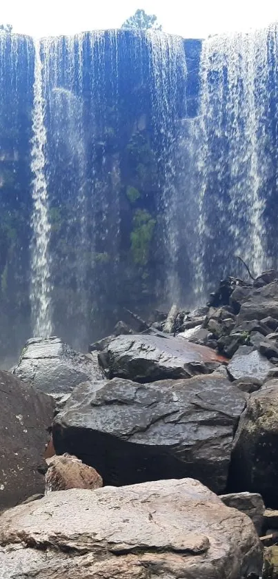 Waterfall cascading over rocky terrain with serene natural beauty.