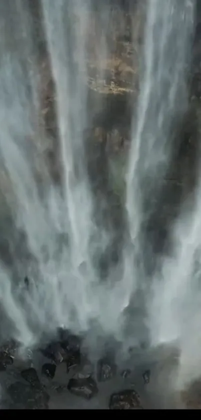 Dynamic waterfall flowing down a rocky cascade.