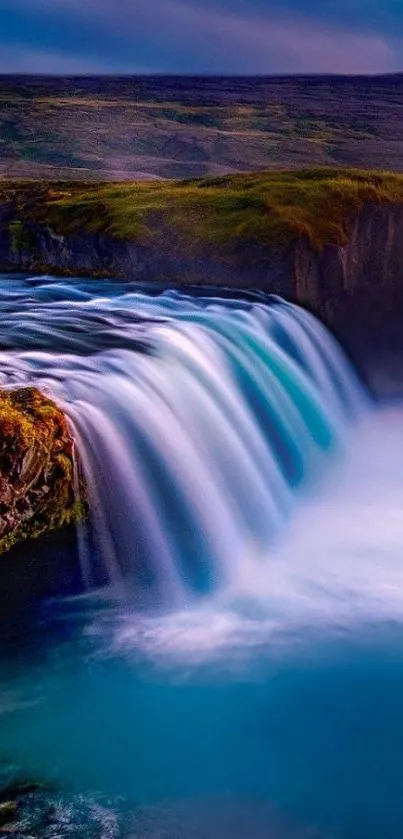 Stunning waterfall with cascading water in a vibrant natural landscape.