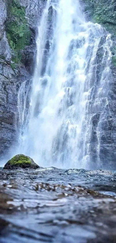 Majestic waterfall cascading in nature.