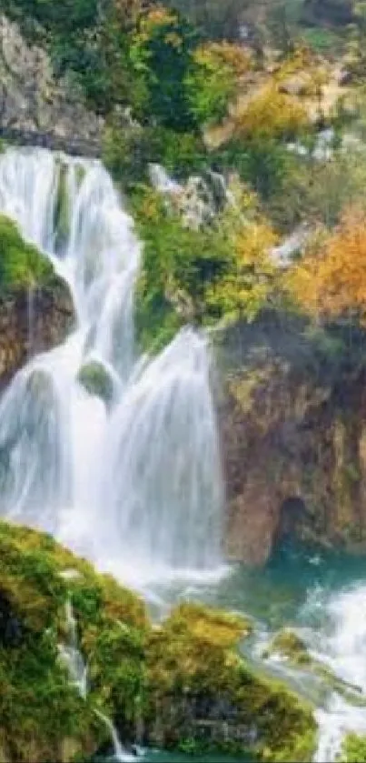 Serene waterfall in lush autumn landscape mobile wallpaper.