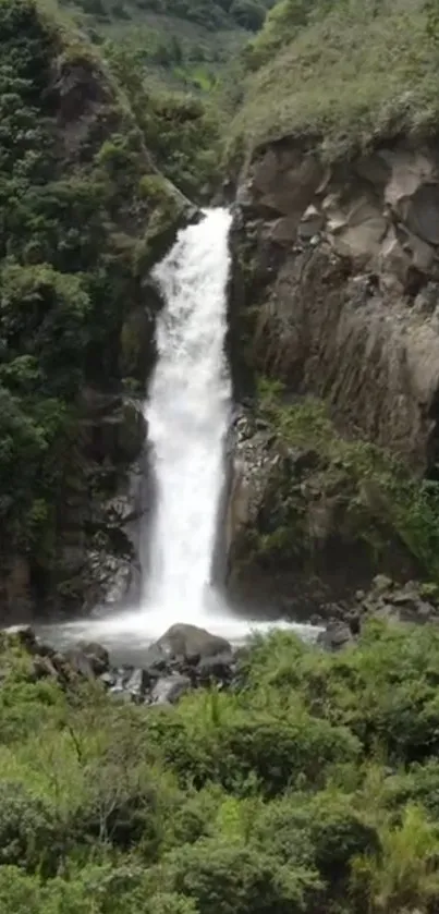 Beautiful waterfall surrounded by lush greenery and rocky cliffs.