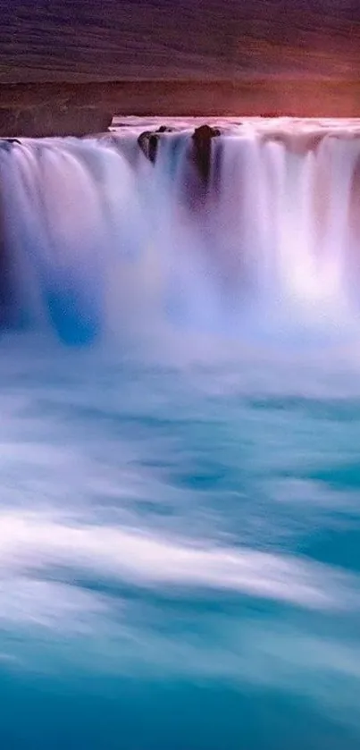 Serene waterfall with blue tones mobile wallpaper.