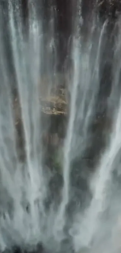 Majestic waterfall cascading down rock face.