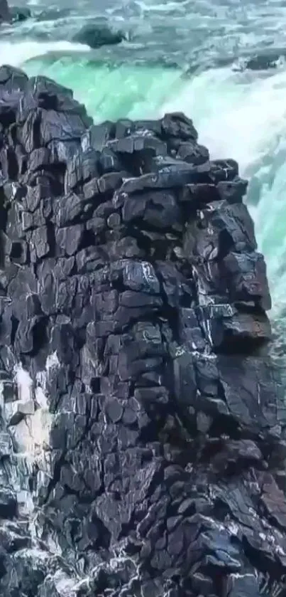 Rocky landscape with cascading waterfall and green waters.