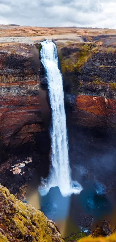 Majestic waterfall in a stunning natural landscape scene.