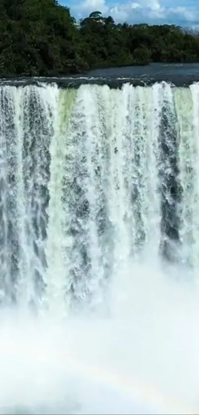 A stunning waterfall cascading in lush greenery, perfect for mobile wallpaper.