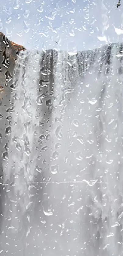 Waterfall with raindrops on a cool, gray backdrop for phones.