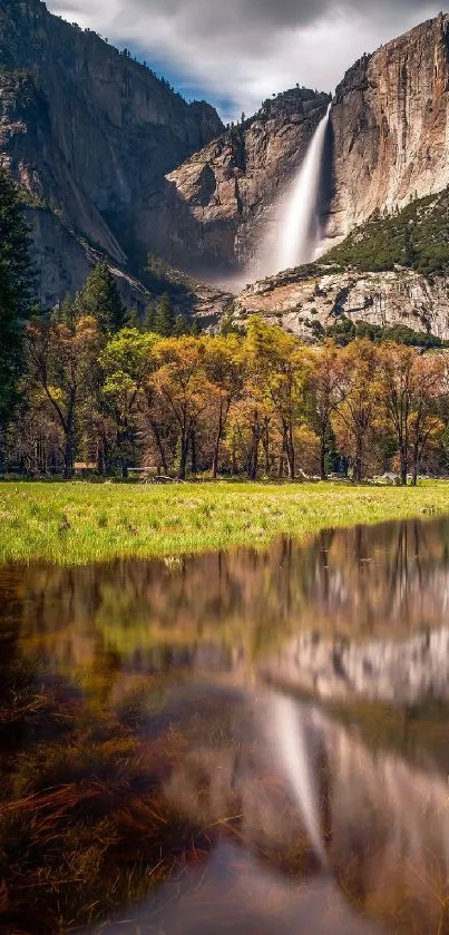 Yosemite waterfall and mountain view with a reflective foreground lake.