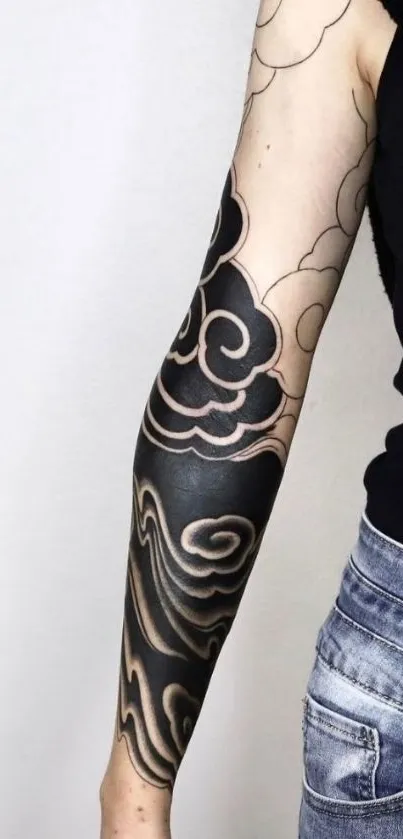 Black and white arm tattoo design with stylish patterns.