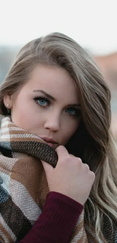 Autumn portrait of a woman with a plaid scarf.