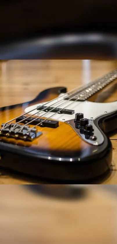 Close-up of a stylish bass guitar on wooden floor.