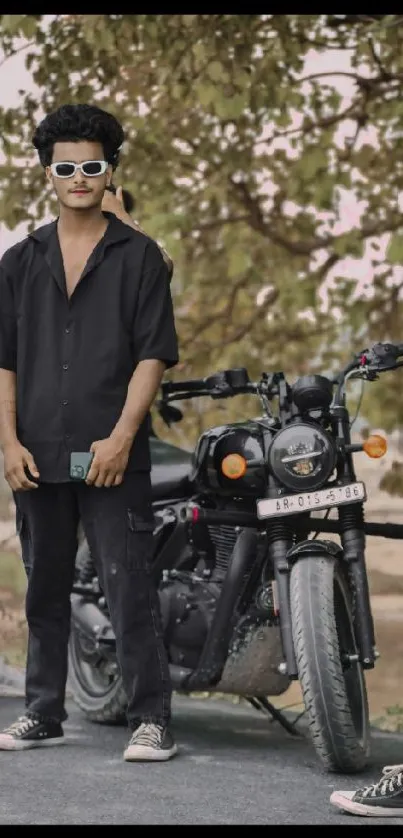 Friends posing with black motorcycle on a sunny day.