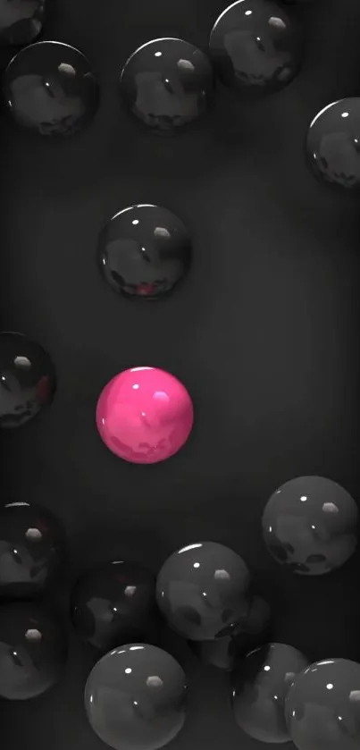 Black spheres with a unique pink sphere in the center.