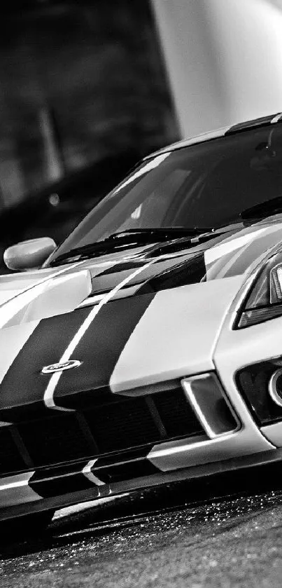 Black and white sports car close-up in modern wallpaper design.