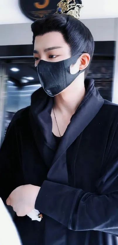 Mobile wallpaper featuring a masked figure in black attire.