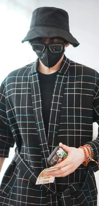 Mysterious figure in a black plaid outfit and mask.