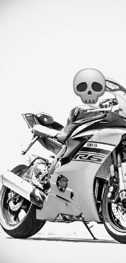 Monochrome sports bike with skull emoji design.