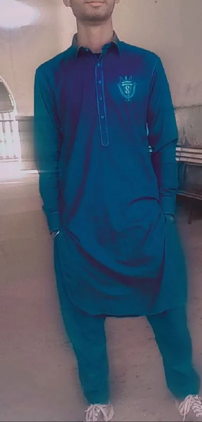 Man in stylish blue kurta and trousers.