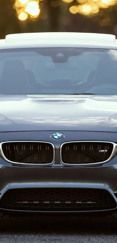 Front view of a sleek BMW car with a luxurious design for a mobile wallpaper.