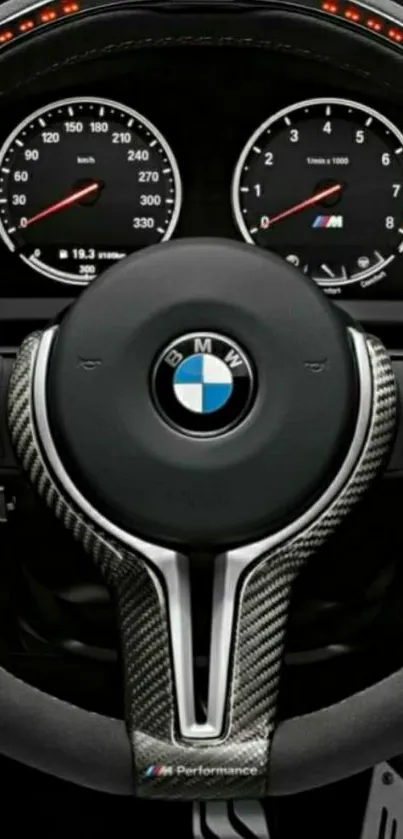 Close-up of BMW steering wheel in sleek design.