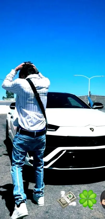 Man standing by sports car under clear blue sky.