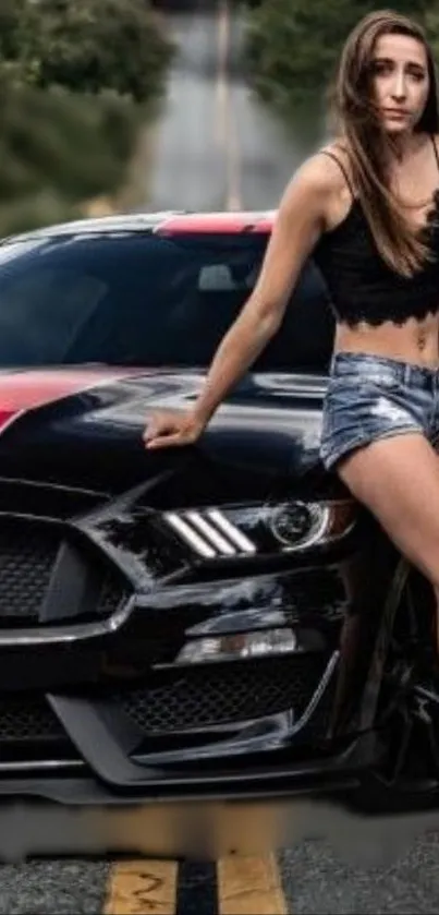 Model poses by a black and red sports car on a street.