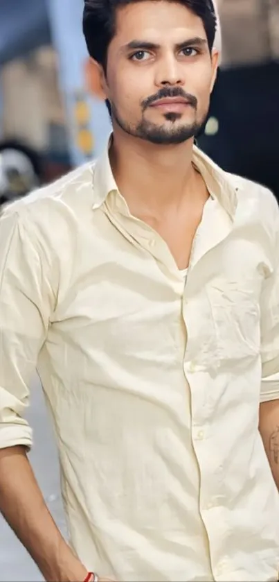 Portrait of a man in a light shirt with a soft background.
