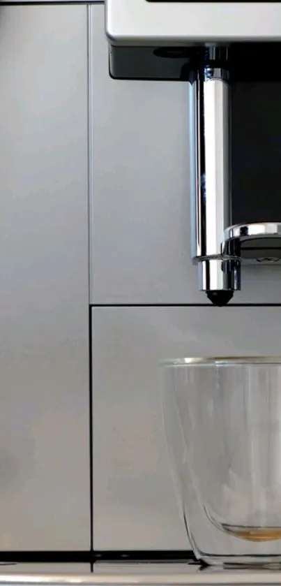 A sleek, modern coffee maker with glass cup.