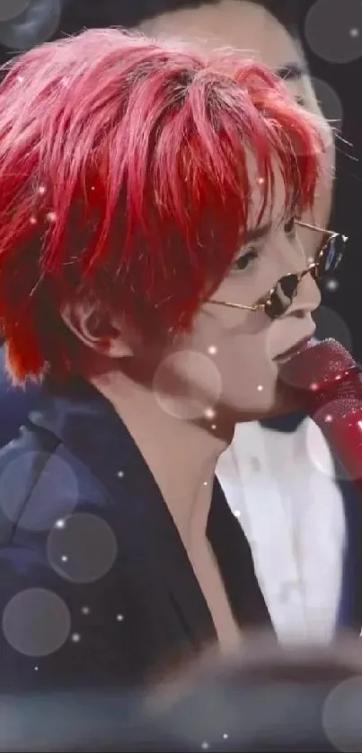 Performer with red hair and microphone during live concert.