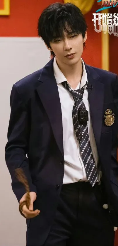 Young man in navy suit with open tie, posing confidently.