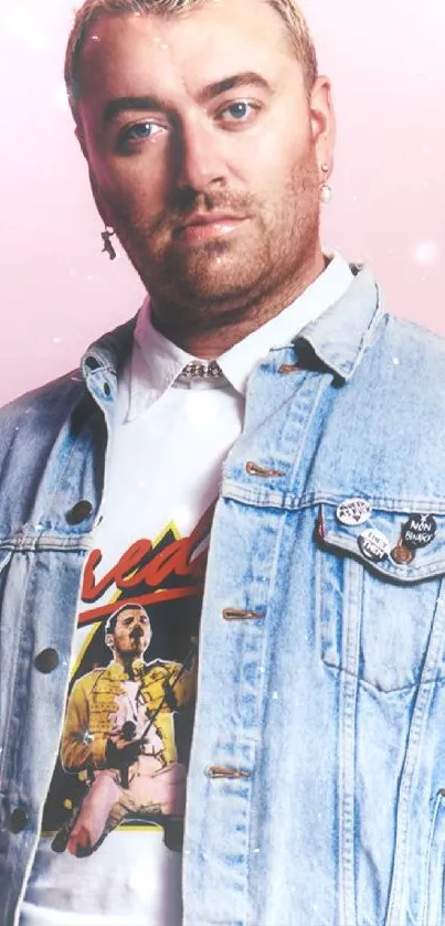 Person in denim jacket with pink background.