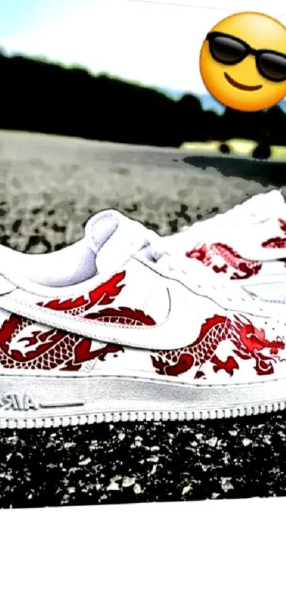 White sneakers with red dragon design on pavement.