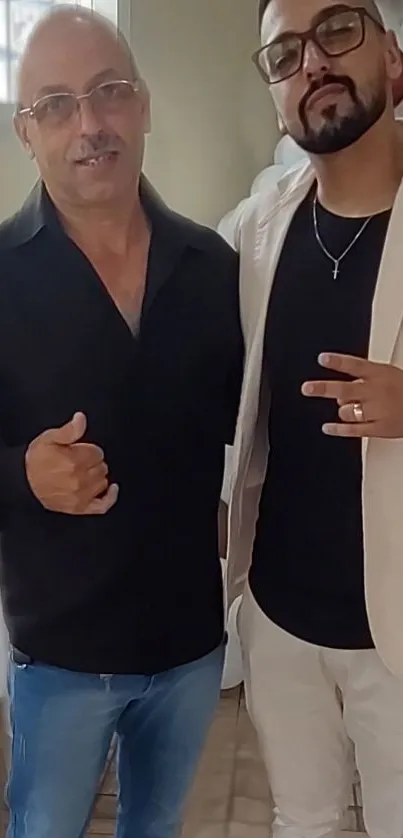 Two men in formal attire posing together at an event.