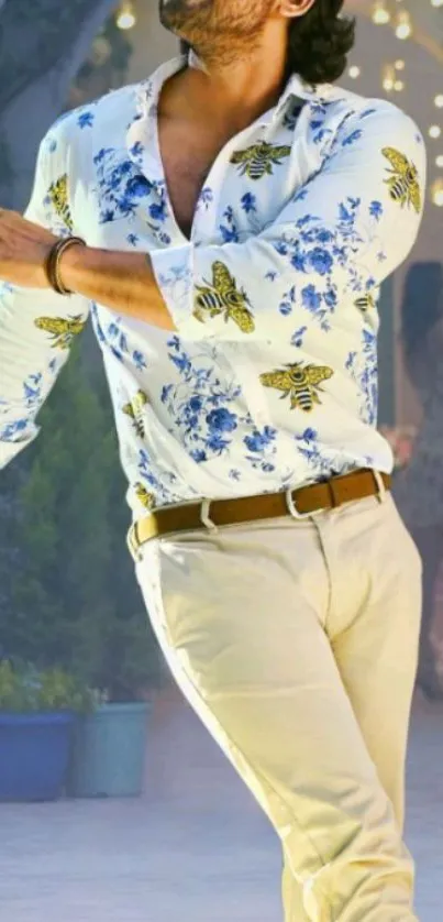 Man in a floral shirt with a sunny, stylish backdrop, ideal for a vibrant wallpaper.