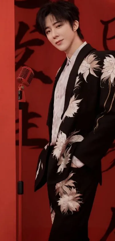 Person in floral suit against red background