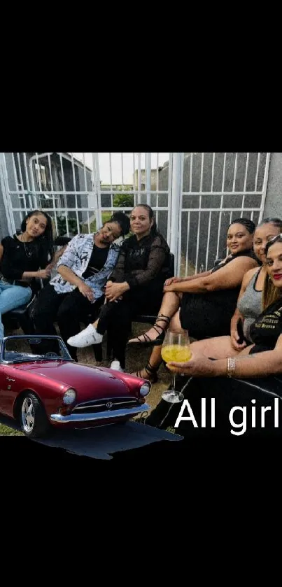 Group of women with a red classic car in outdoor setting.