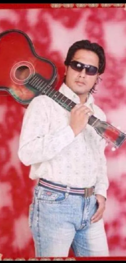 Stylish man with guitar on red background.