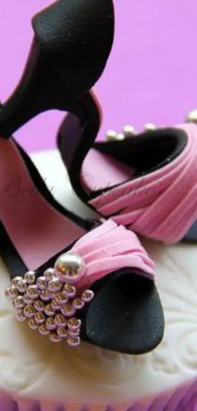 Pink high heels on cupcake with artistic style, vibrant purple background.