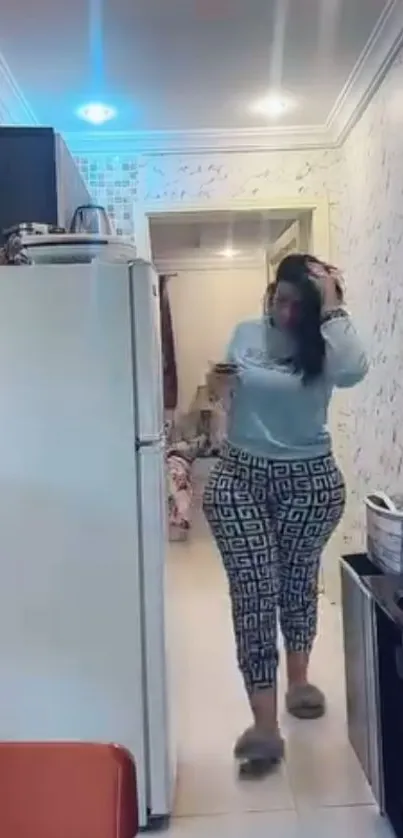 Woman in stylish indoor setting with TV and decor.