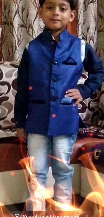 Young boy in a blue jacket, striking a stylish pose.