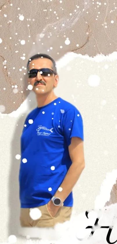 Man in blue shirt with sunglasses on textured wallpaper.